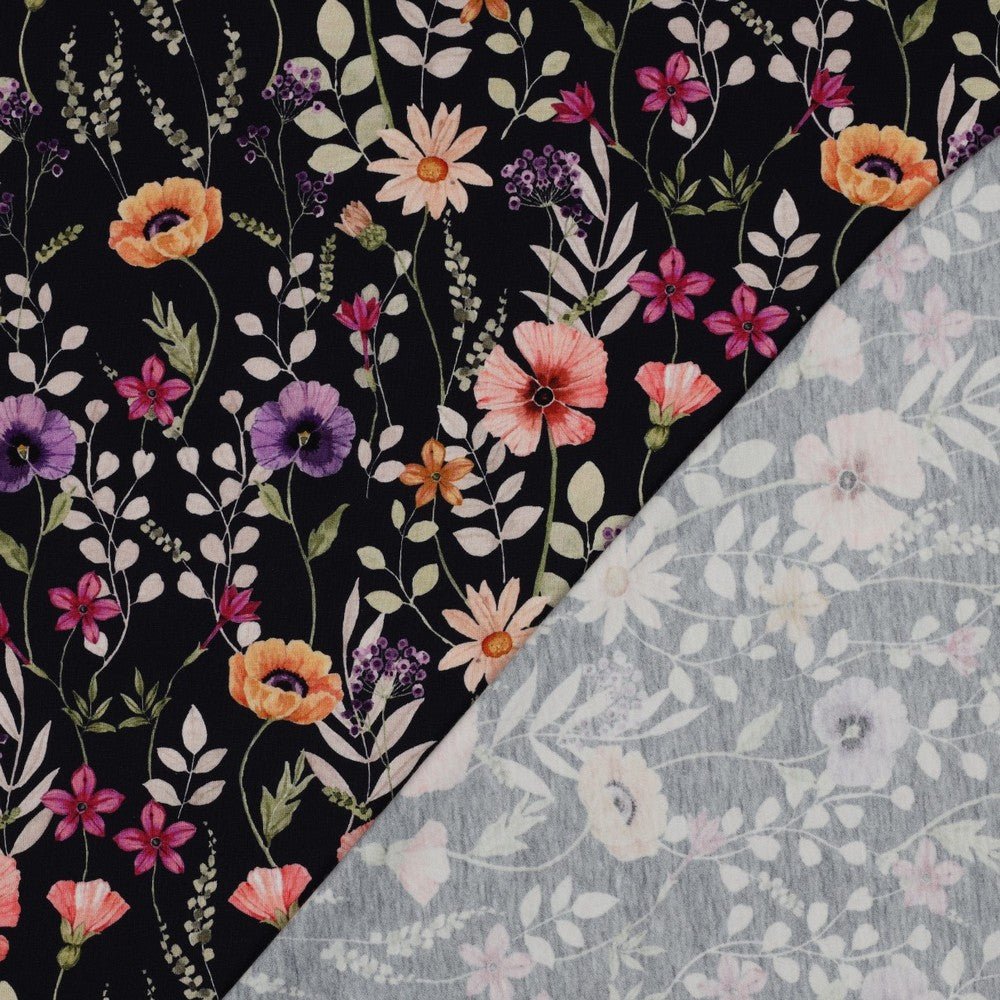 Kokvilnas trikotāža - pļava uz melna fona 200 g/m²