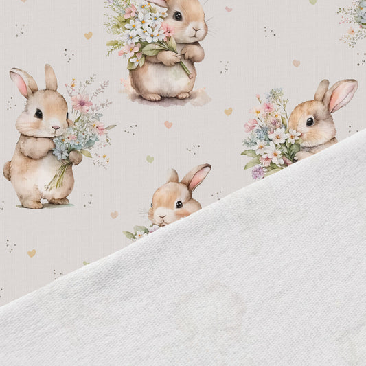 Puuvillane silmustrikotaaž - jänesed lilledega 250 g/m²