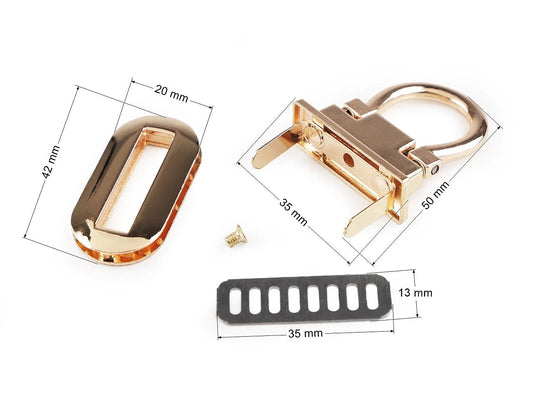 Pilt metallist kotilukust/kinnitusest 20 × 42 mm – kuldset värvi – saadaval veebis Šarlotes audumi juures