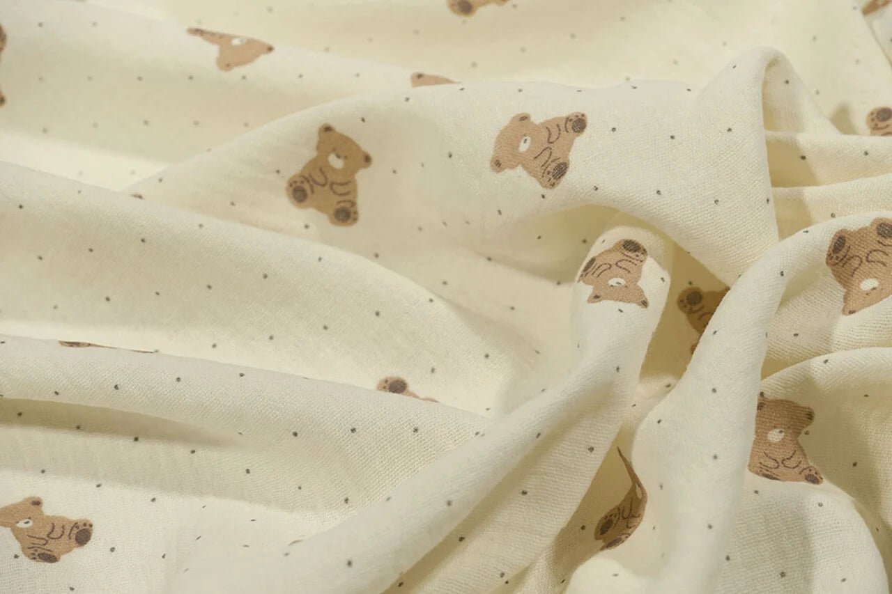 Muslīns - lācīši uz sviesta dzeltena fona 125 g/m²