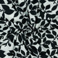 Dress fabric with elastane - black and white leaf pattern 80 g/m²