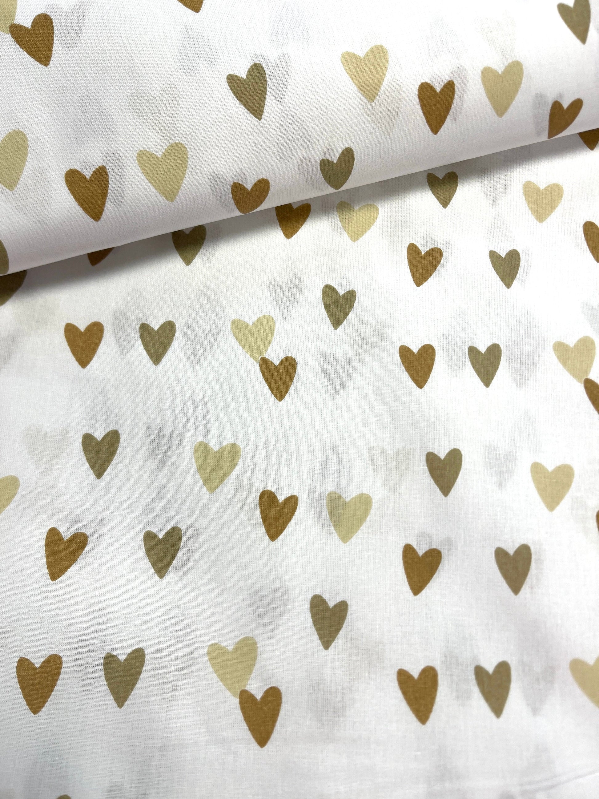 Attēls ar 100% Kokvilnas audums - brūnas sirsniņas 125 g/m² – pieejams Šarlotes audumi