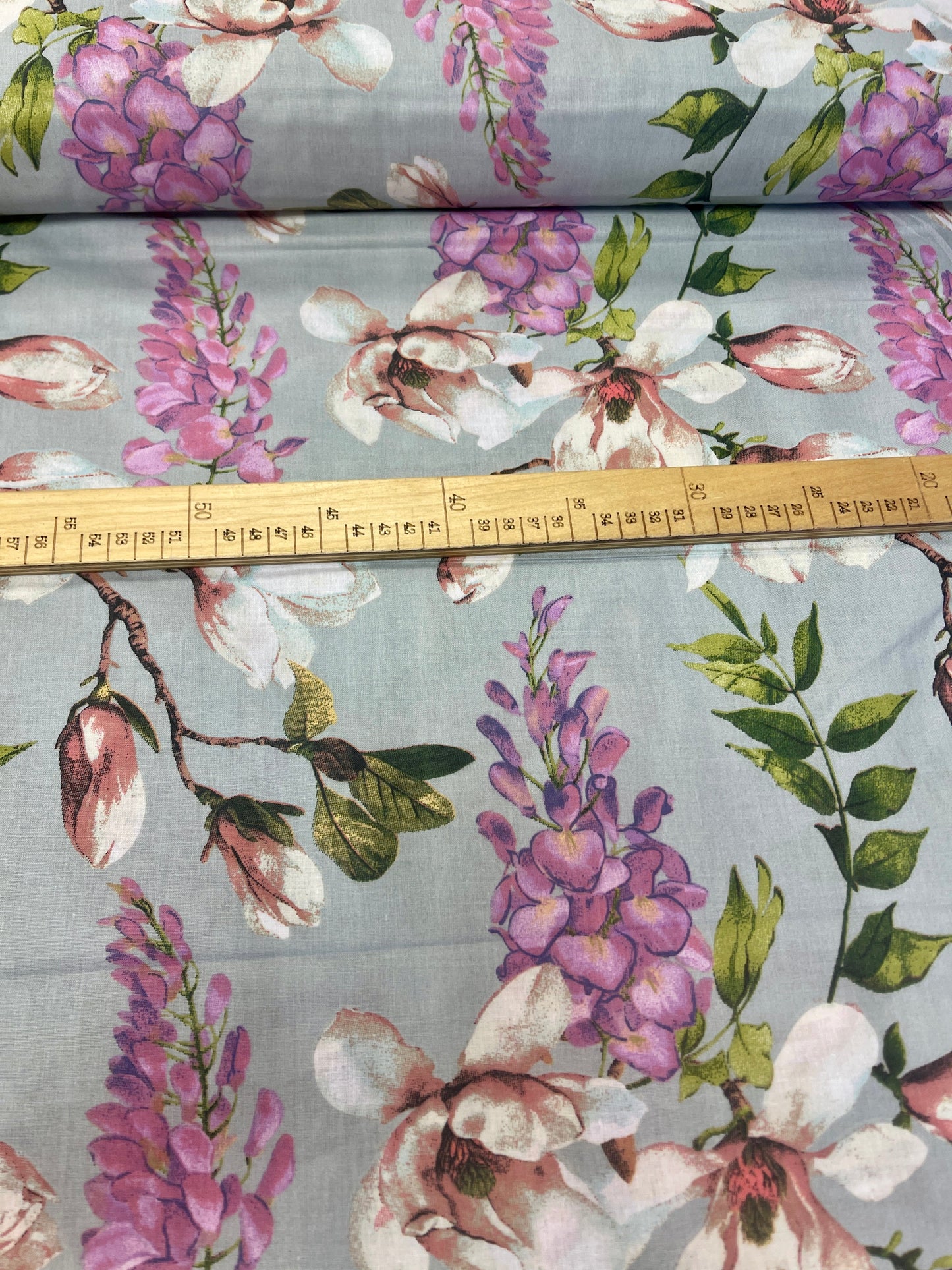 Image of 100% cotton fabric with magnolias on gray – available online at Šarlotes audumi