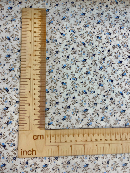 Image of 100% cotton fabric with tiny, delicate flowers – available online at Charlotte's Fabrics