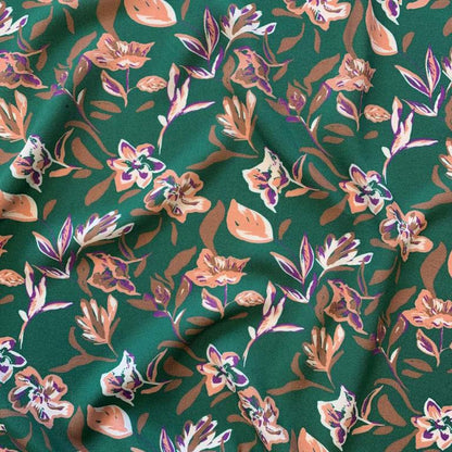100% viscose fabric - abstract floral pattern on a green background 125 g/m²