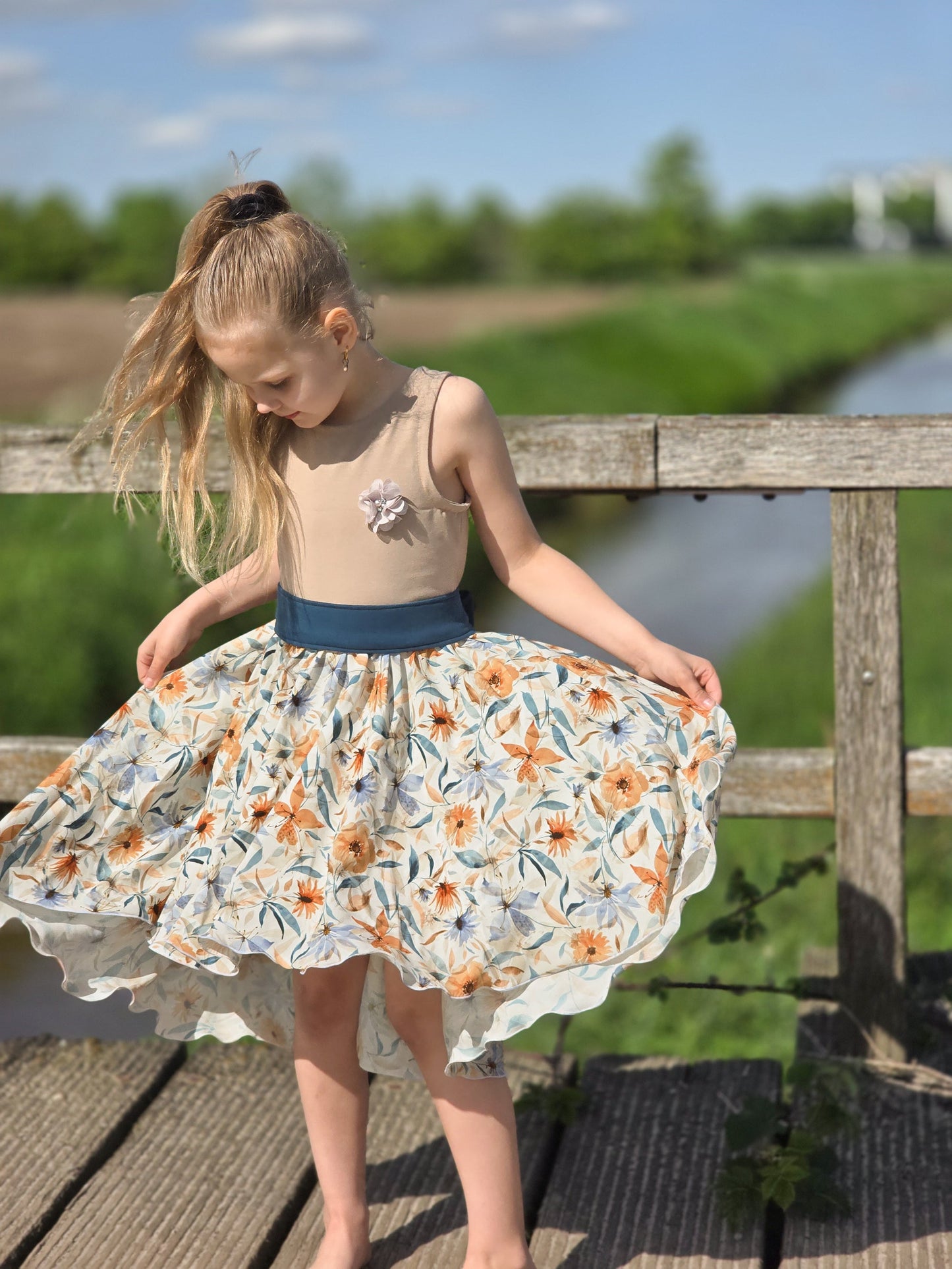 Image of 100% viscose fabric with blue and orange floral pattern – available online at Charlotte's Fabrics