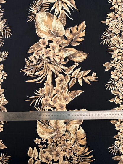 Italian cotton fabric with tropical floral pattern on a black background – 120 g/m²