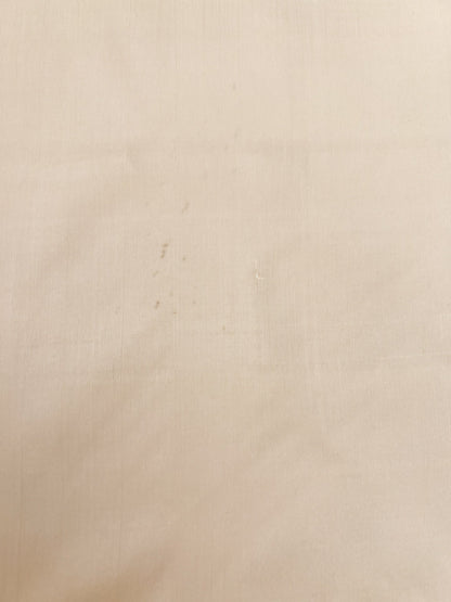 Image of Italian 100% silk fabric in a creamy white shade – available online at Charlotte's Fabrics