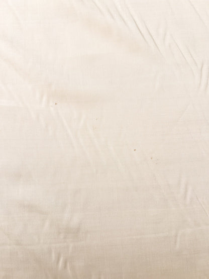 Image of Italian 100% silk fabric in a creamy white shade – available online at Charlotte's Fabrics