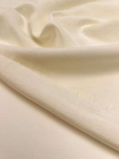 Image of Italian 100% silk fabric in creamy white, available online at Šarlotes audumi
