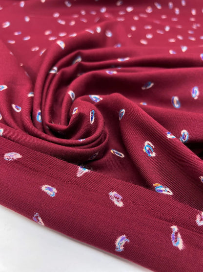 Image of Italian twill fabric in burgundy with a subtle pattern – available online at Charlotte's Fabrics
