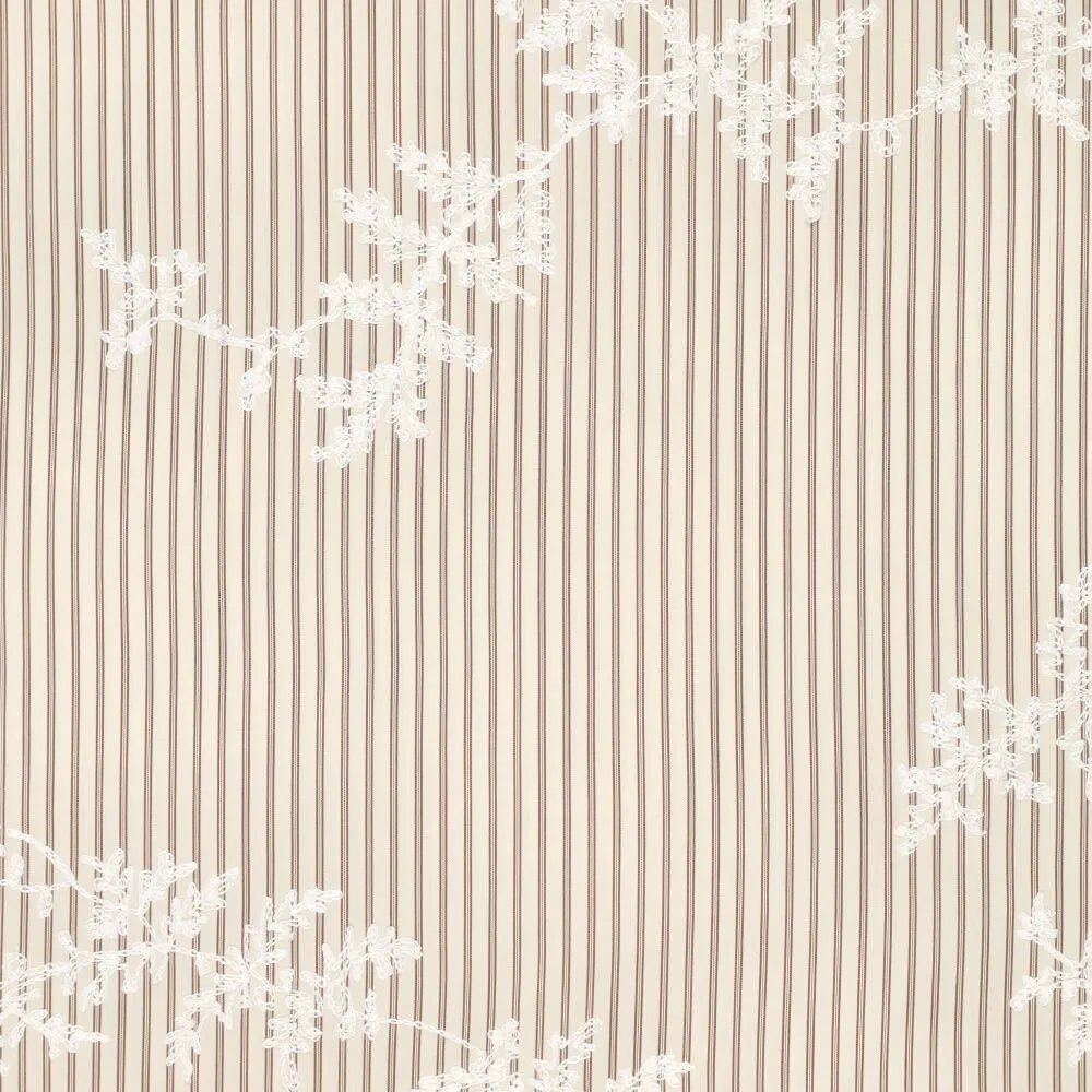 Embroidered cotton fabric with lines and white embroidered flowers – available online at Charlotte Fabrics