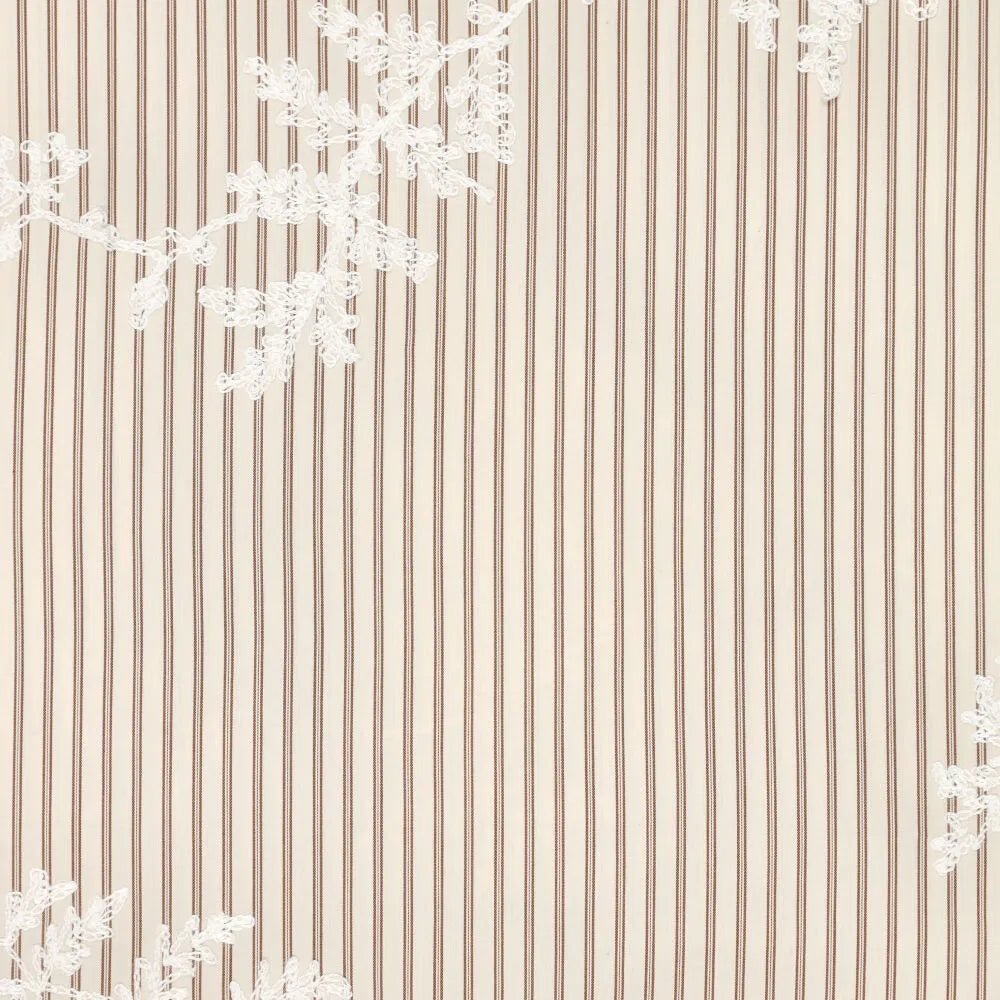 Image of embroidered cotton fabric with lines and white embroidered flowers – available online at Charlotte's Fabrics