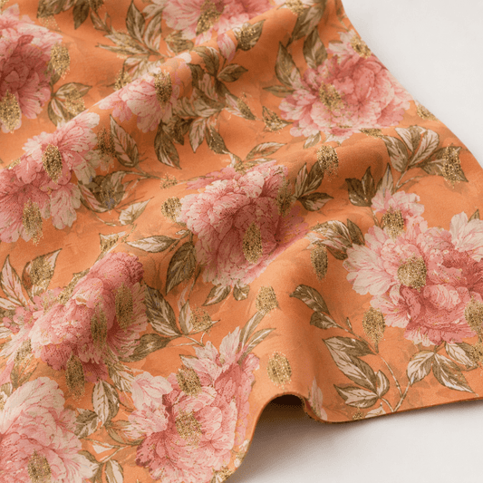 Image of dress fabric with gold accents and flowers – available online at Charlotte's Fabrics