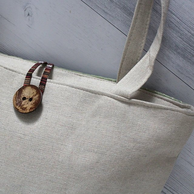 Coconut button with two holes 15 mm – available online at Charlotte's Fabrics