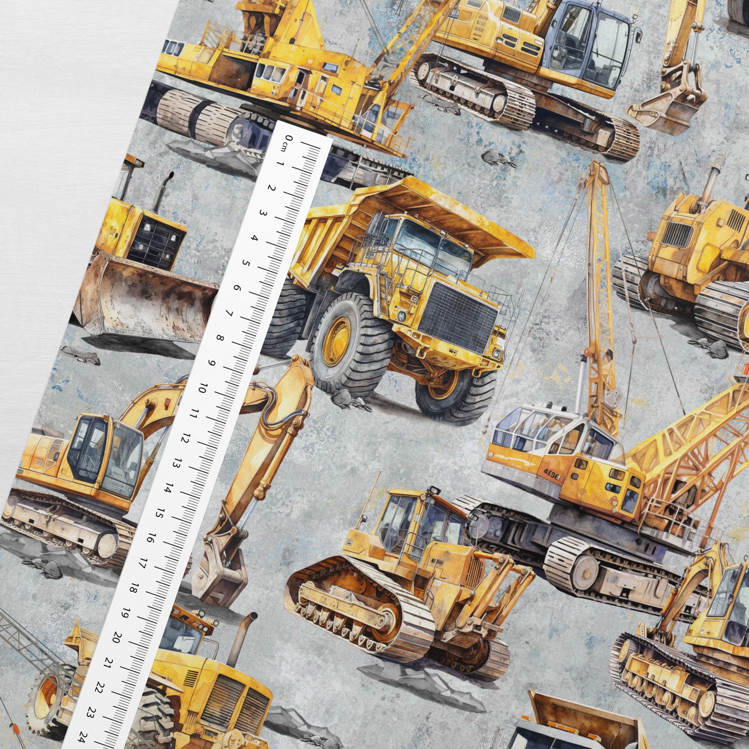 Image of cotton loopback knit, heavy-duty dump trucks in a quarry – available online at Charlotte Fabrics