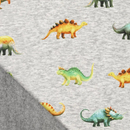 Pilt puuvillase soojustusega trikookangast | Alpen fliis-dinosaurused hallil – saadaval veebis Šarlote kangad