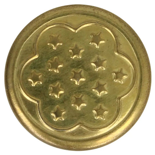 Image of a metal jeans button, 17 mm, gold with a flower – available online at Šarlotes audumi