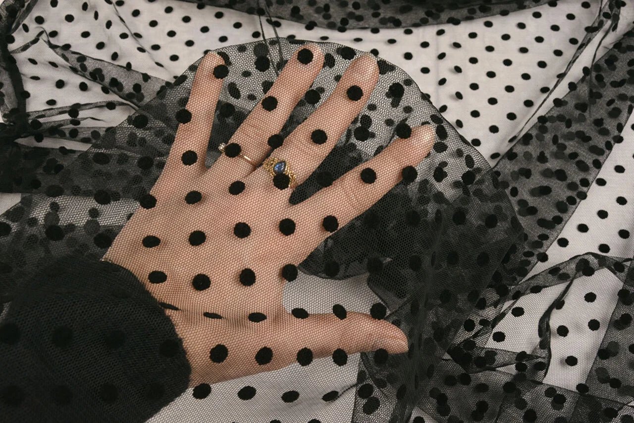 Soft tulle with velvet dots - black, available online at Charlotte's Fabrics