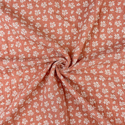 txt
Mousseline - fleurs blanches sur fond orange 130 g/m²