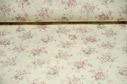 Mousseline à fleurs sur fond blanc laiteux 140 g/m²
