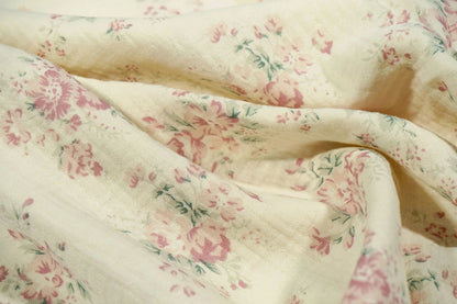alt
Mousseline - fleurs sur fond blanc laiteux 140 g/m²