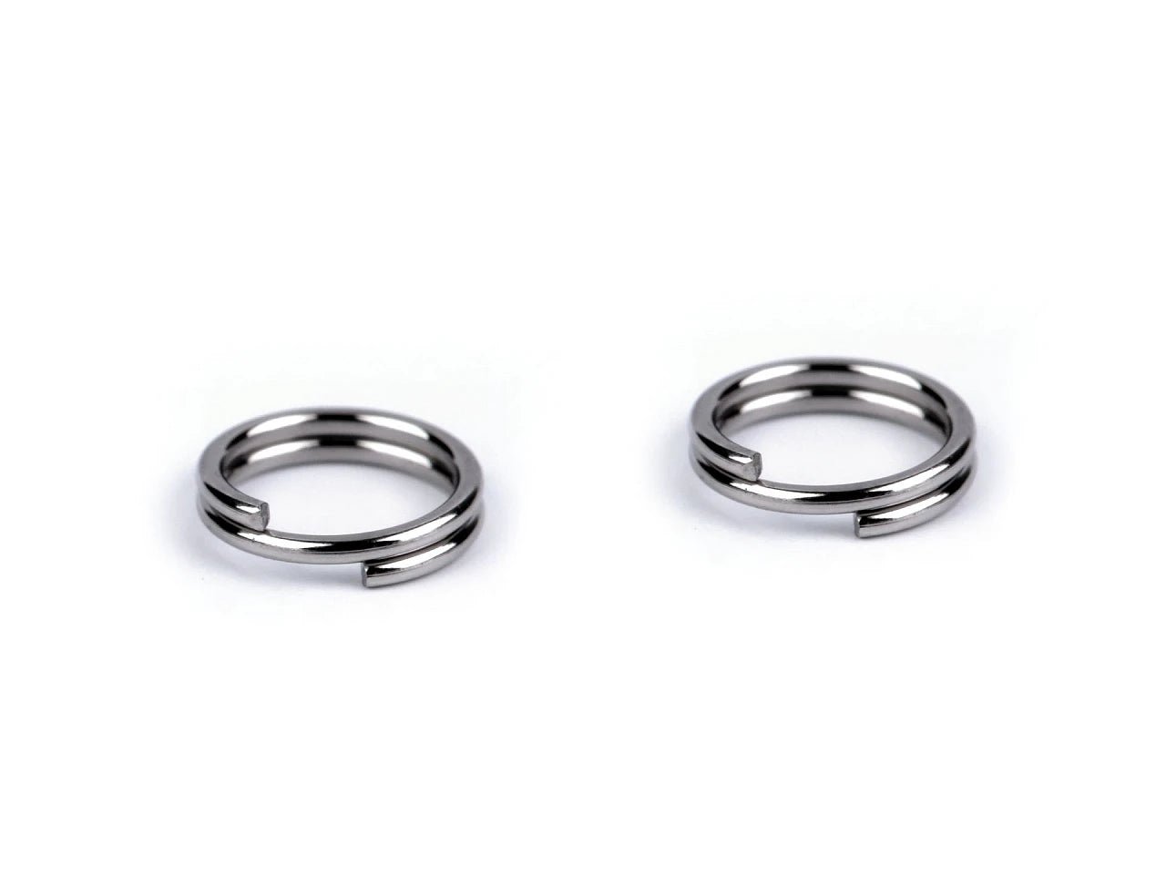 Attēls ar Nerūsējošā tērauda savienojošie gredzeni (split jump rings) Ø6 mm 10 g – pieejams Šarlotes audumi