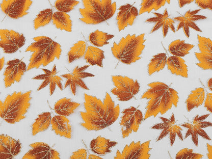 Organza fabric with a shimmering autumn leaf pattern – available online at Charlotte's Fabrics