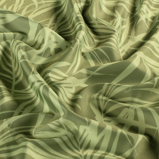 Image of a swimwear lycra fabric with UPF50 protection – olive green leaves 200 g/m² – available at Charlotte's Fabrics