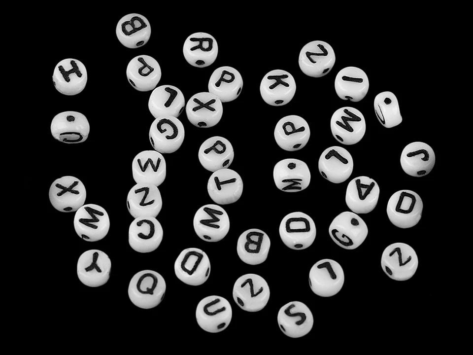 Image of flat glass beads with letters – 6 mm, white with black letters – available online at Šarlote's Fabrics