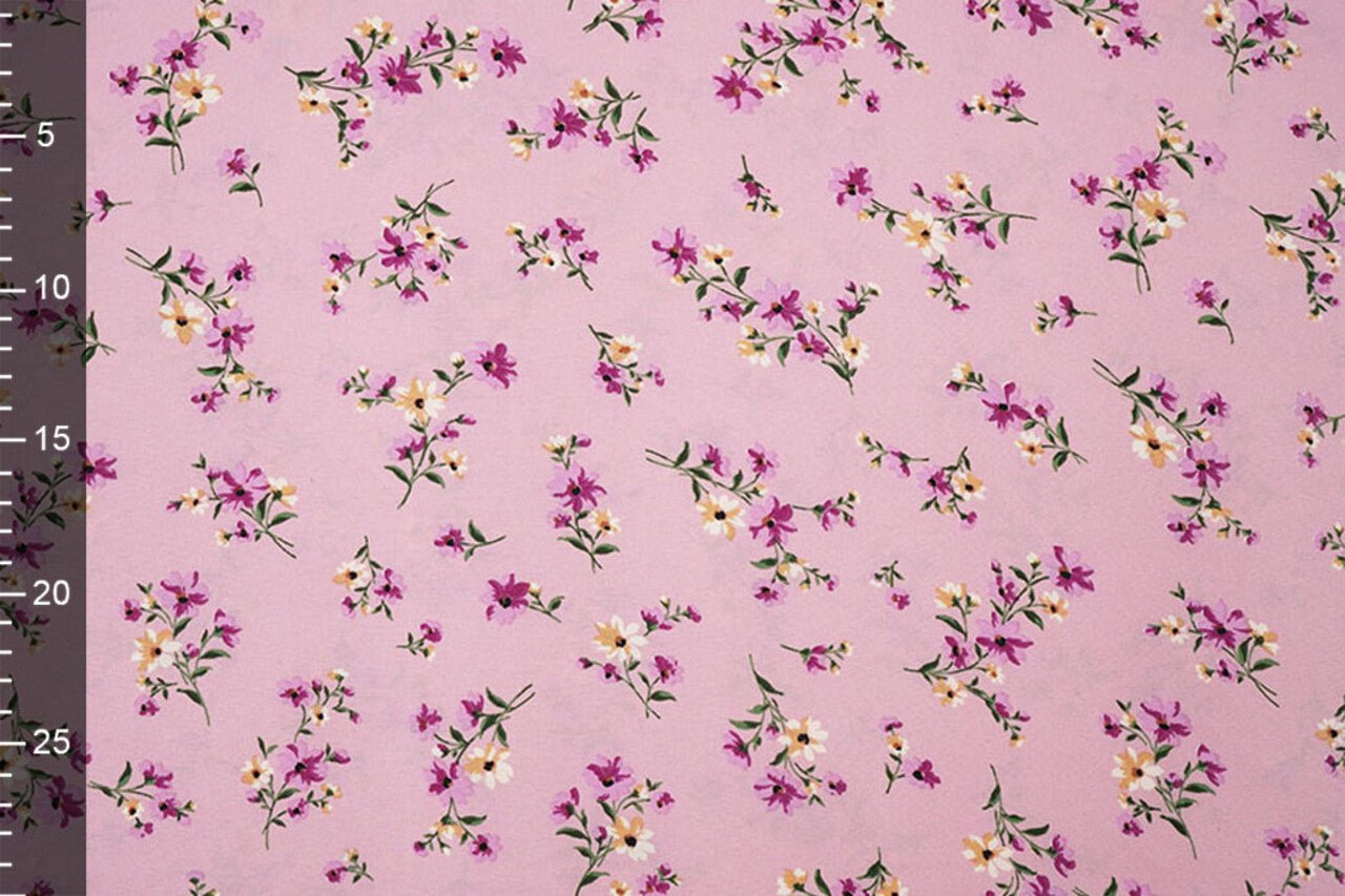 Image of thin crepe fabric with pink flowers – available online at Šarlotes audumi