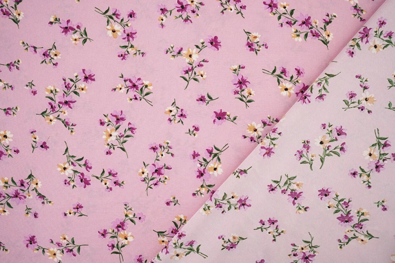 Image of thin crepe fabric with pink flowers – available online at Charlotte's Fabrics