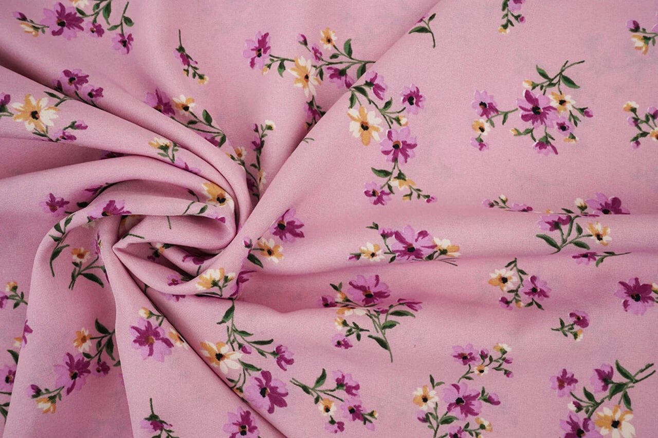Image of thin crepe fabric with flowers in pink – available online at Charlotte's Fabrics