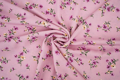 Image of thin crepe fabric with pink flowers – available online at Charlotte Fabrics