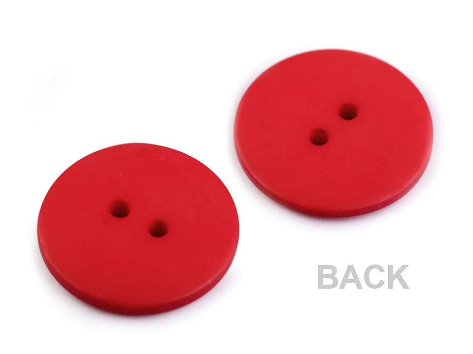 Plastmasas pogas 22.7 mm - baltas