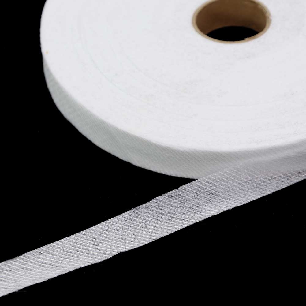 Pilt kaldlõikega tugevduskangast paelast – valge, 20 mm – saadaval veebis Šarlotes audumi