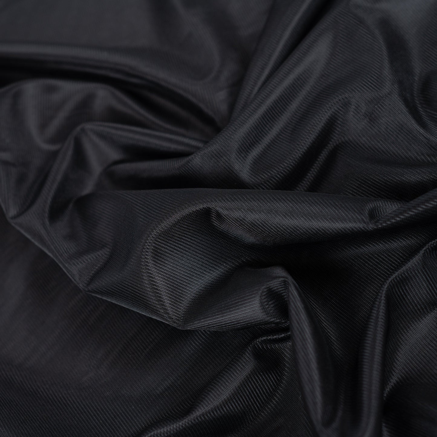 Image of black knitted lining fabric – available online at Šarlotes audumi