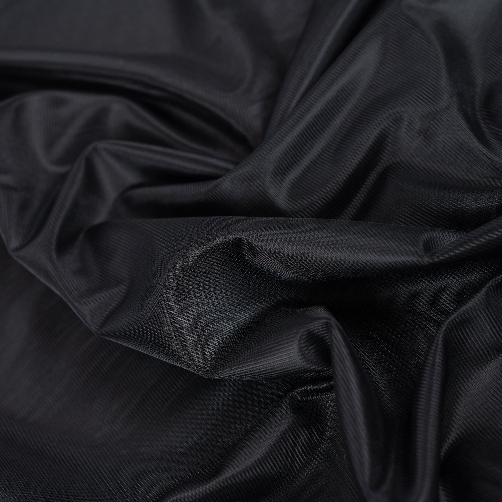 Image of black knitted lining fabric – available online at Šarlotes audumi