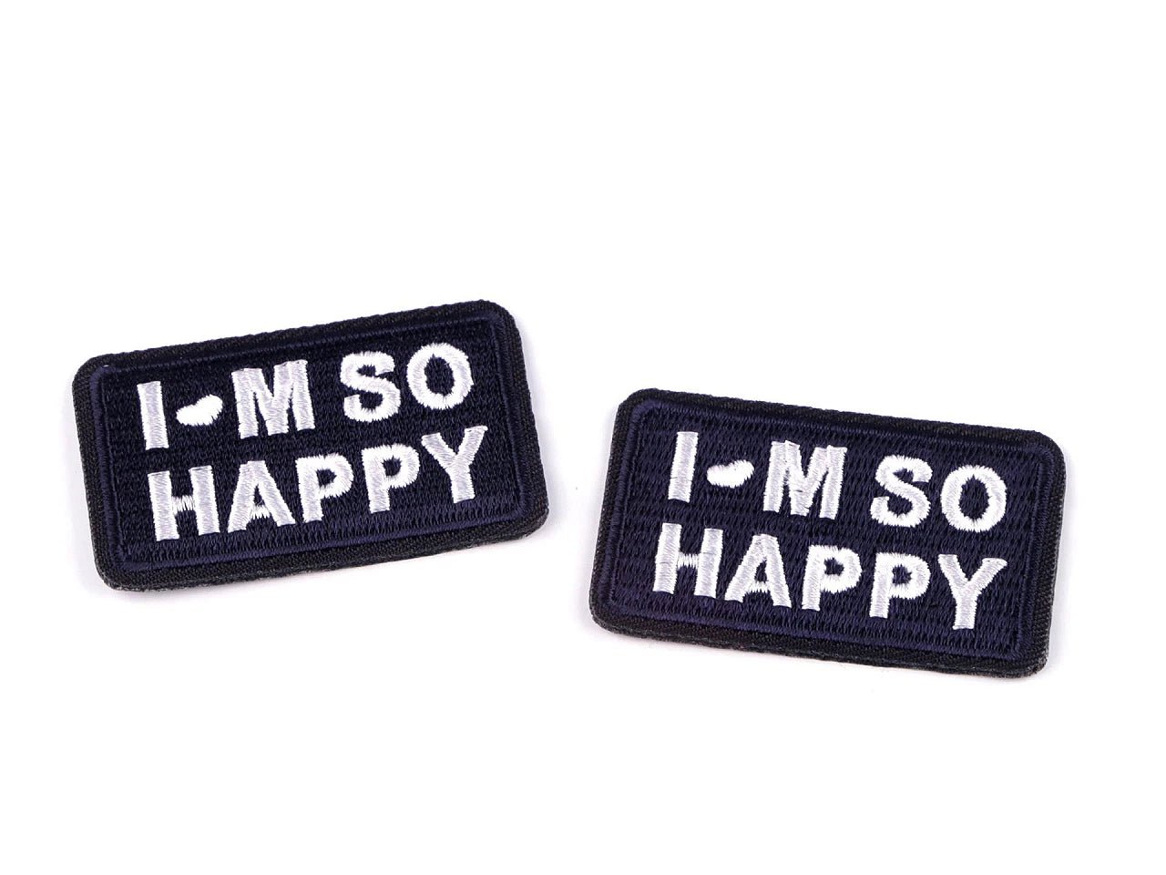 Image of iron-on appliqué “I’M SO HAPPY” – 3 × 5 cm – available online at Charlotte's Fabrics