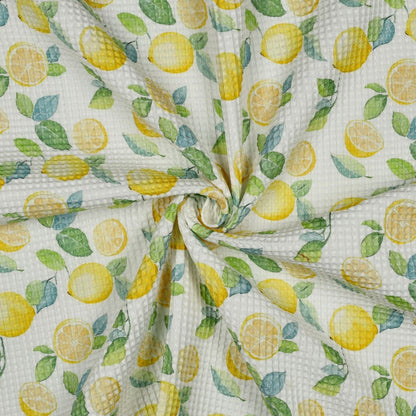 Image de tissu gaufré - citrons 185 g/m² – disponible chez Šarlotes audumi