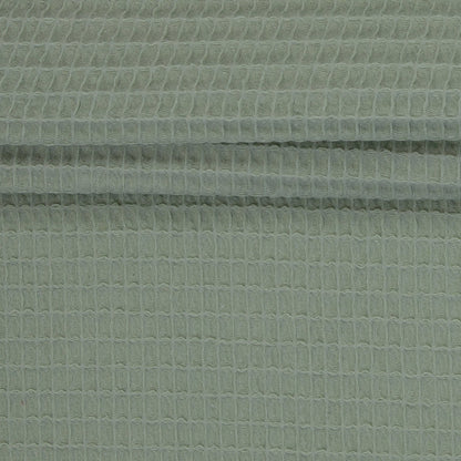 Image de tissu gaufré vert grisâtre 230 g/m² – disponible chez Šarlotes audumi